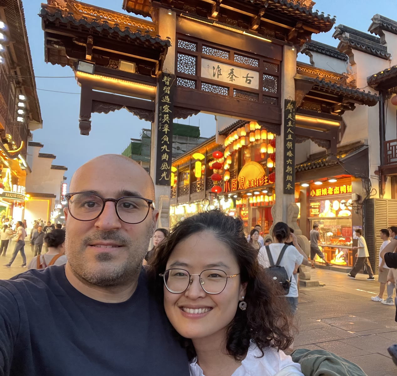 Haonan and Payam at a lantern-lit market street